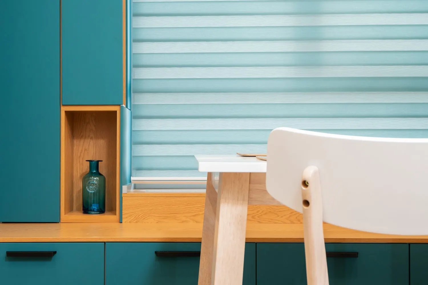Day and night blind with sheer and solid bands in a kitchen